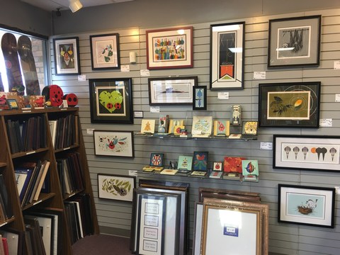 view of decorative tiles, ready-made frames, and framed Charley Harper artwork at the Tri-County store